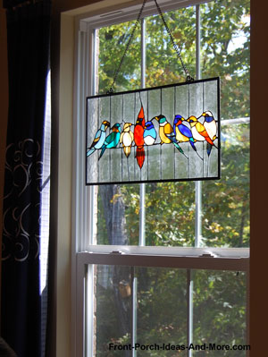 stained glass panel with a variety of birds in window