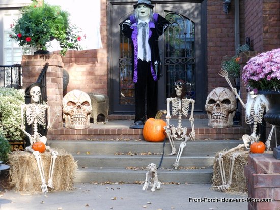 a family of bones and skeletons greet visitors to your front door