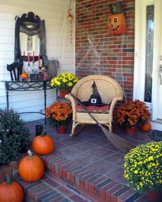 witch hat and broom on front porch