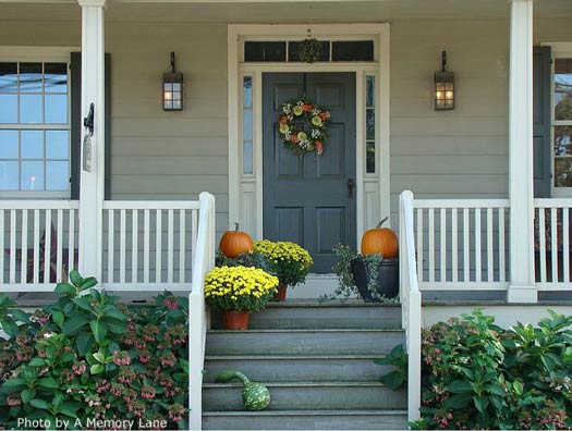 mums and pumpkins on front porch