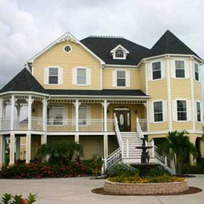 large yellow beach house and porch