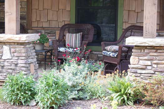pleasant landscaping in front of porch