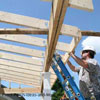workers building porch roof