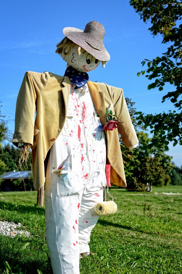 Happy painter scarecrow