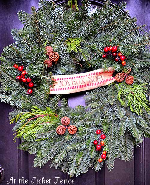 Holiday wreath with pine cones and berries