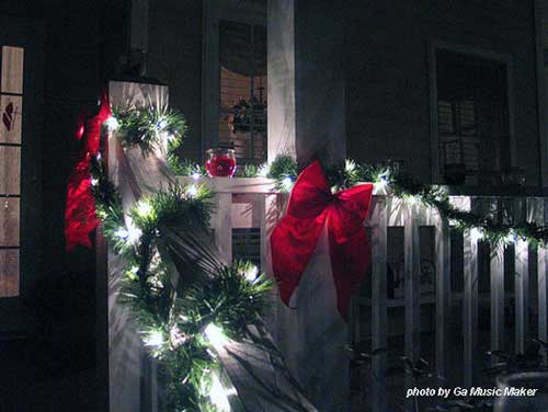 Christmas light idea - garland and red bows with twinkly lights