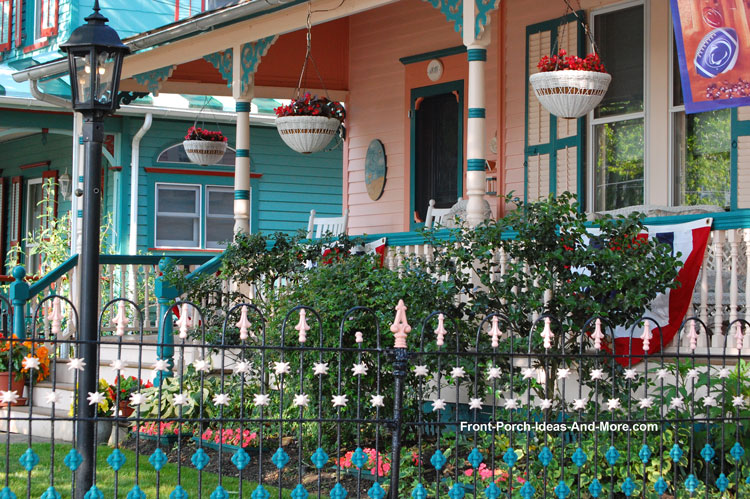 front porch and wrought iron fencing