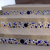 concrete porch steps with mosaic tile