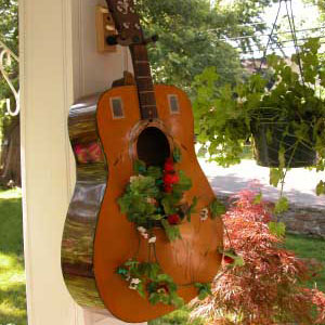 guitar on front porch for container gardening on the porch