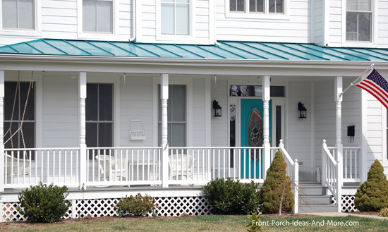 wrap around porch with vibrant torquoise front door