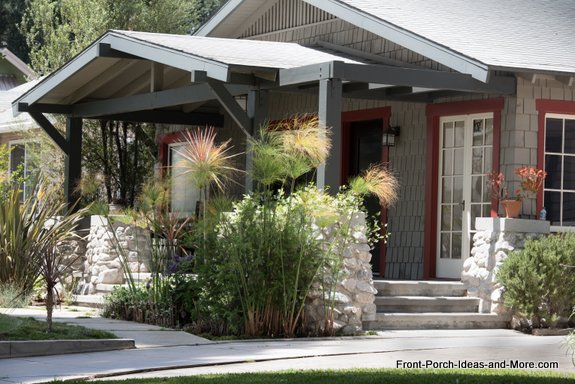 decorative planters enhance the look of this small porch