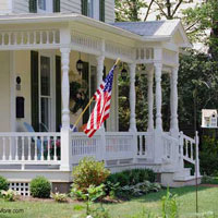 curb appealing front porch with flag