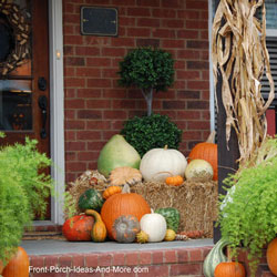 porch with pumpkins and corn stalks for fall