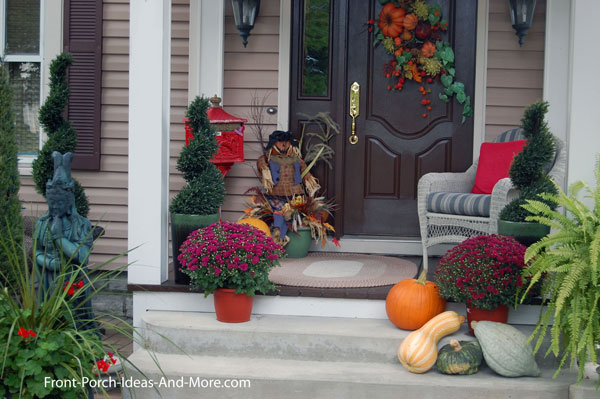 Front porch with old fashioned mailbox and fall decorations