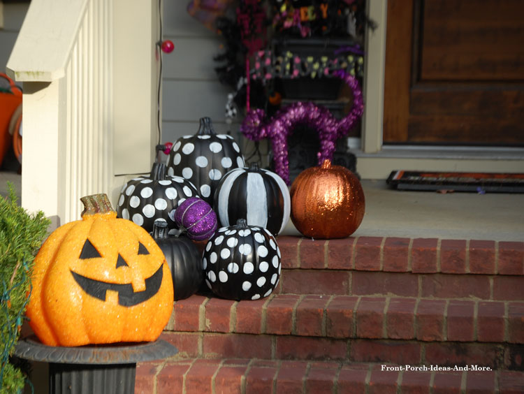 decorative fall and Halloween pumpkins on porch steps