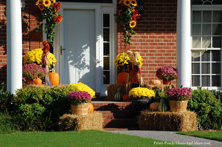 small front porch decorated for autumn in splended colors