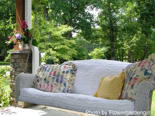 Anna's swing on her front porch - wicker, chenille, all so comfy