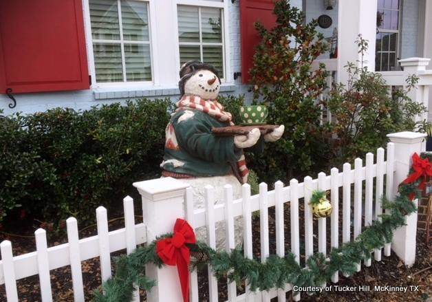 Frosty the snowman at the picket fence