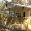 mobile home porch with wheel chair ramp and picket fence