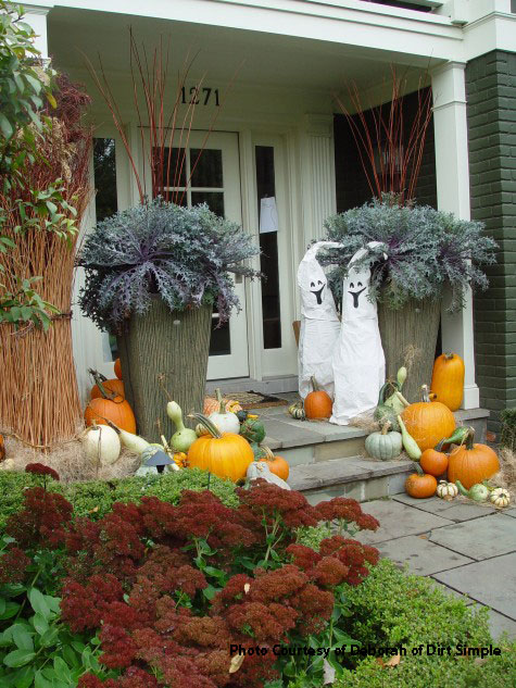 sheet ghosts and autumn decorations on porch
