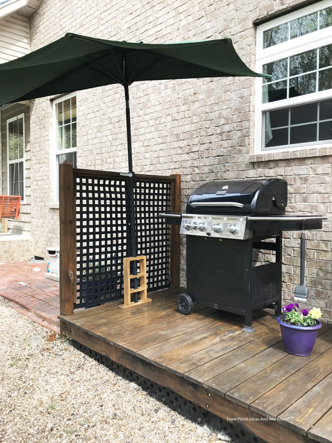 half umbrella over grill area