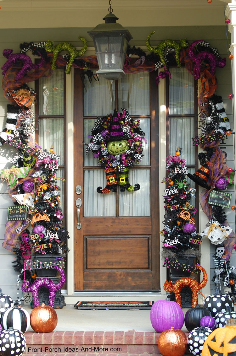 front porch door decoated with Halloween garland