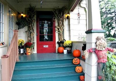 cornstalks and scarecrows on front porch