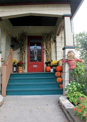 carved pumpkins line front steps