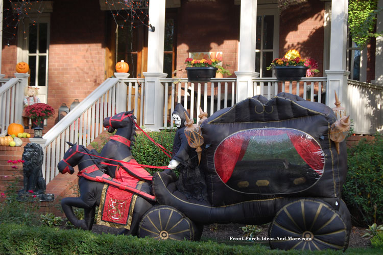 horse drawn halloween hearse inflatable in front of porch