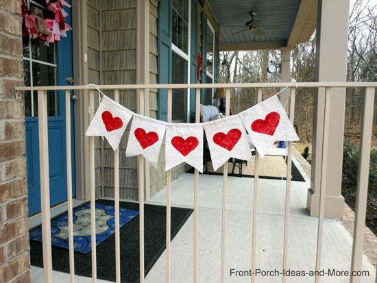 Heart garland on porch inspired by Kara from the Happy Go Lucky Blog