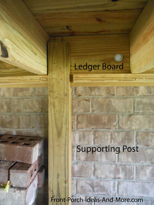 porch ledger board supported by post