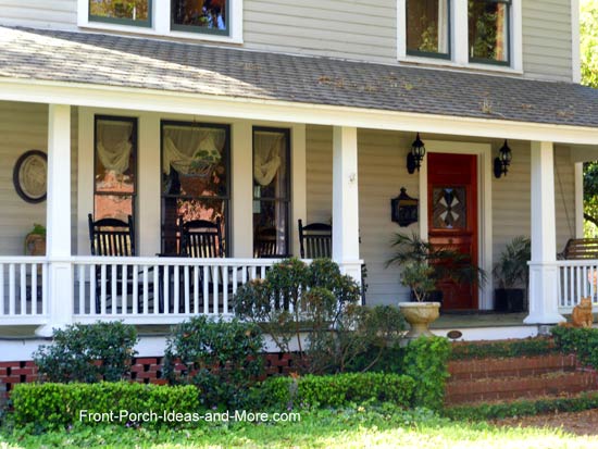 Black rockers on top front porch