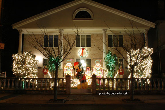 front of house lit with christmas lights and decorations