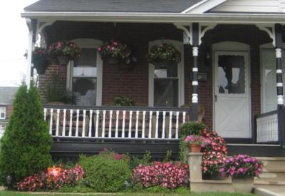 Northeastern porch of a twin brick home