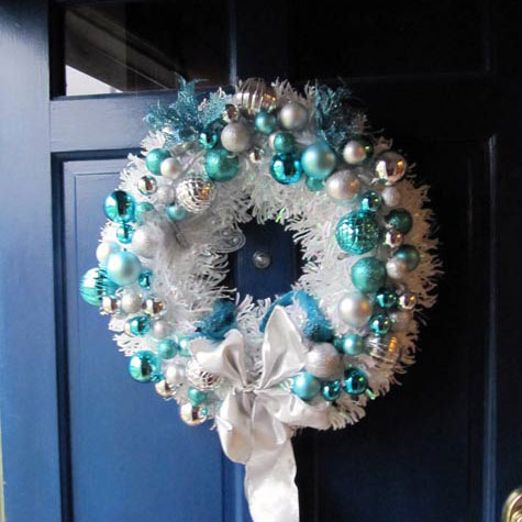 white and blue christmas wreath on front door