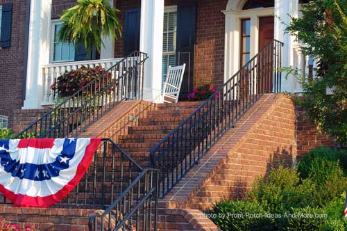 Beautiful iron outdoor hand rails on patriotic front porch