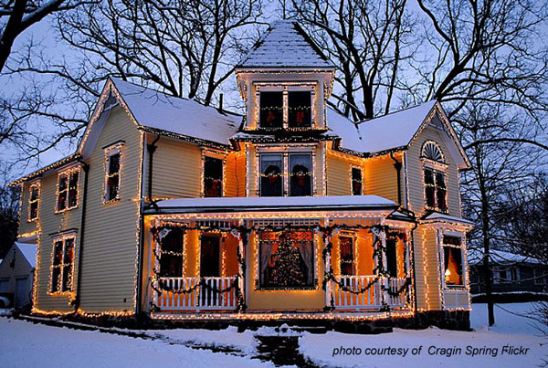 Victorian home outlined in Christmas lights
