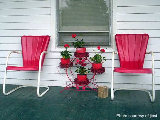 Retro red metal chairs on country porch