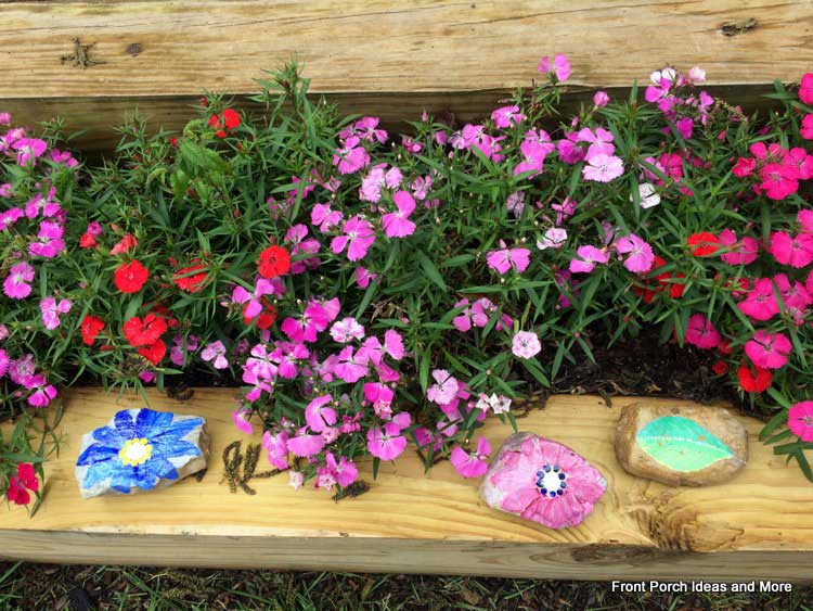 DIY painted rocks in the garden are a nice idea for someone you love
