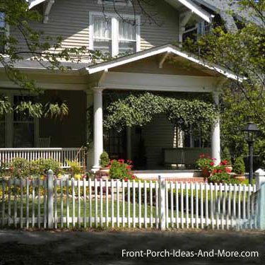 picket fence in front of wonderful front porch