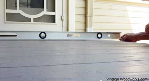 stone masons reset corners of the porch to correct height