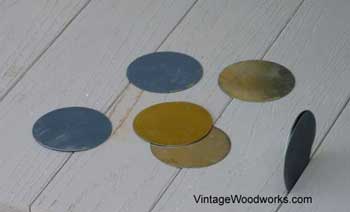 Because porch floor wasn't square, they used disks as spacers to correct the problem