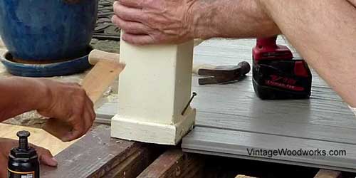Use a jack and 2x4s to relieve the pressure from the post to the beam.
