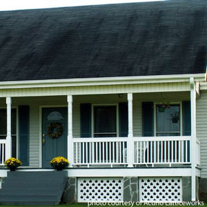 white custom vinyl lattice as porch skirting under front porch on home