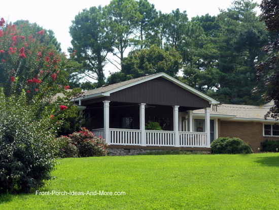 rather large gable roofed front porch on ranch style home
