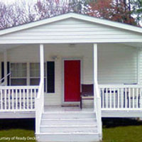 mobile home front porch with bright red door