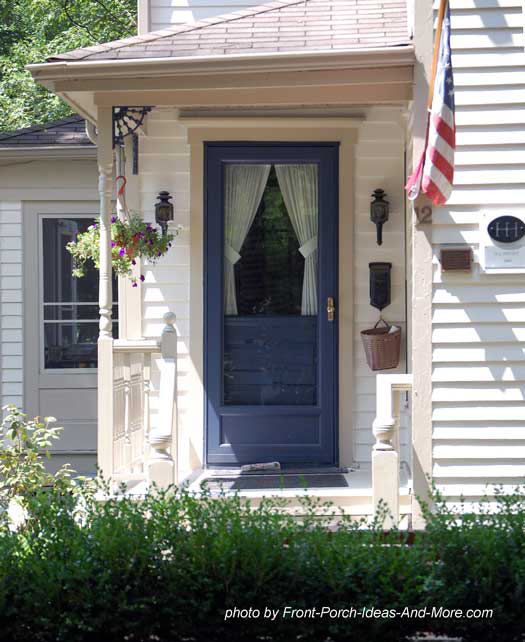 small porch with striking blue front door