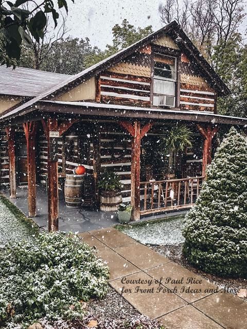 early snow on log cabin in Colorado