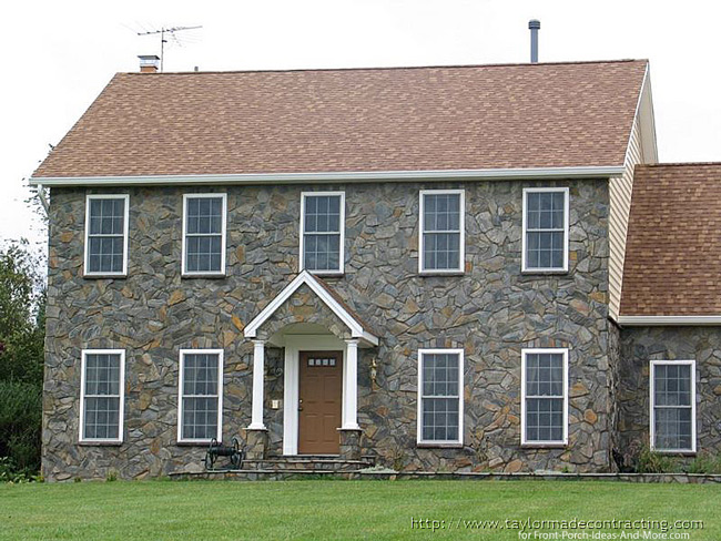stone arched portico with gable roof line