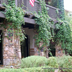 beautiful stone porch columns with ivy